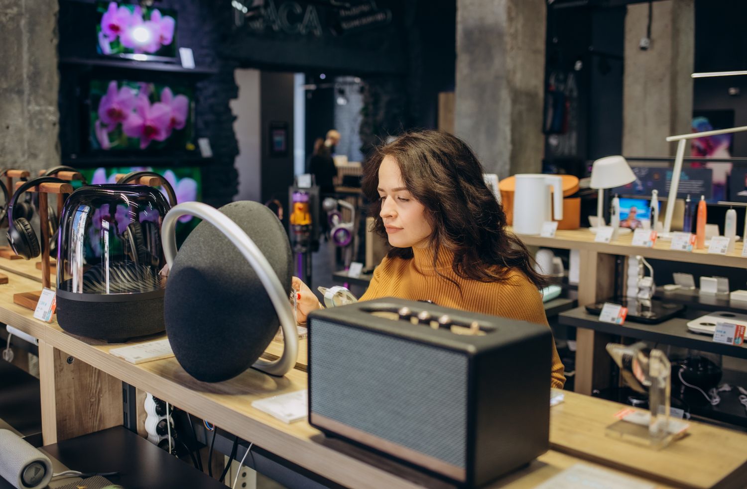 woman shopping for speakers