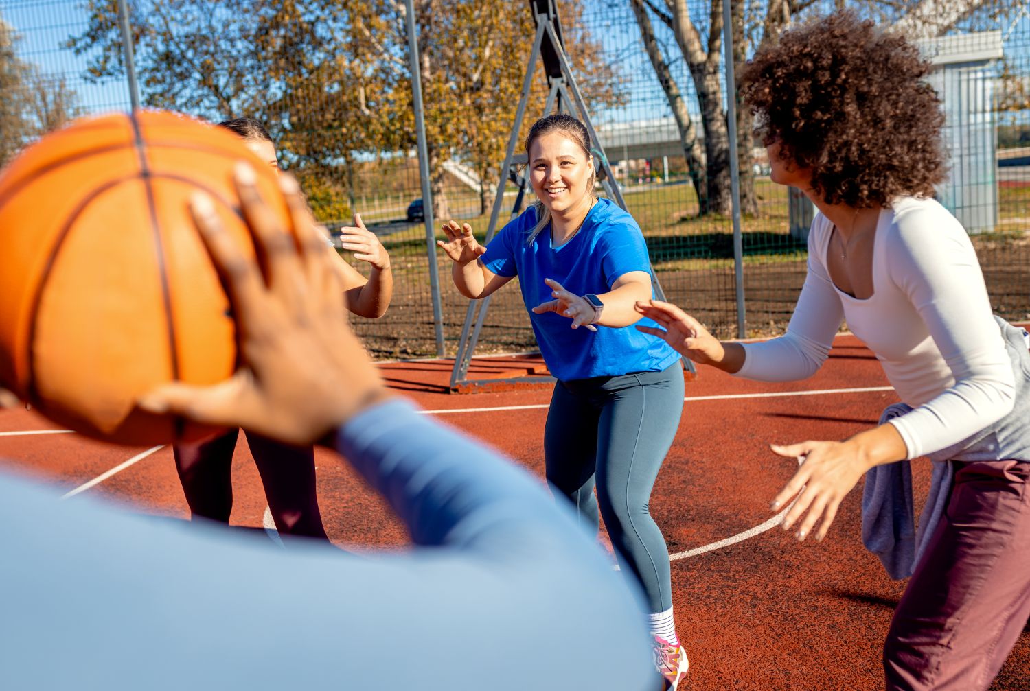 women happy playing sports